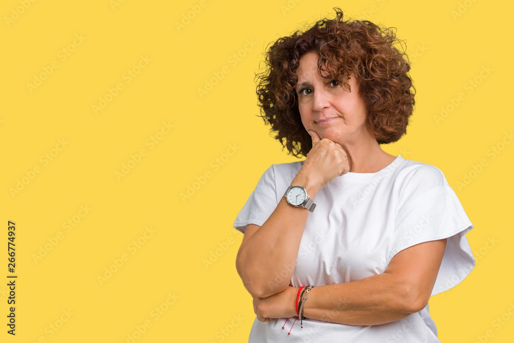 Beautiful middle ager senior woman wearing white t-shirt over isolated background with hand on chin thinking about question, pensive expression. Smiling with thoughtful face. Doubt concept. Beautiful middle ager senior woman wearing white t-shirt over isolated background with hand on chin thinking about question, pensive expression. Smiling with thoughtful face. Doubt concept.