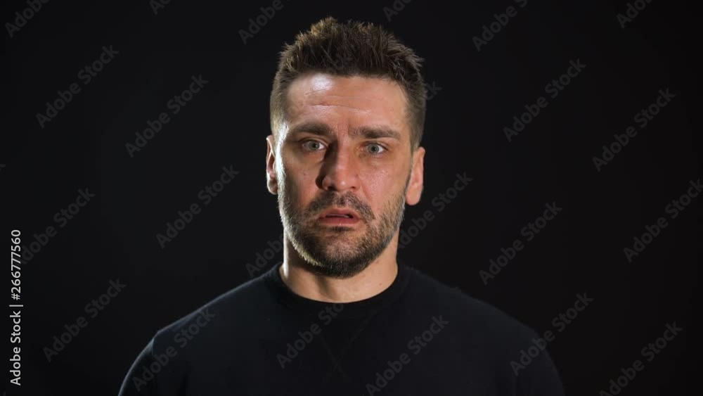 Terrified caucasian man covering head by hands, mental disease, szhizophrenia