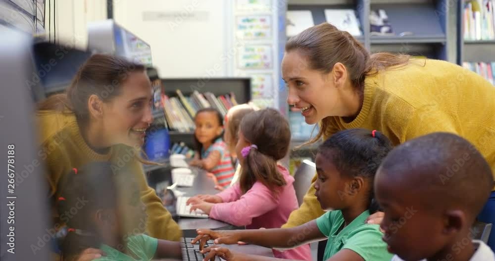 Side view of mixed-race schoolkids studying on computer in the classroom 4k Side view of mixed-race schoolkids studying on computer in the classroom 4k