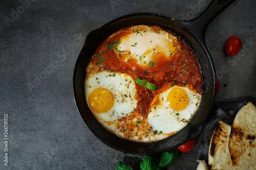 Homemade Shakshouka - Eggs poached in spicy tomato sauce