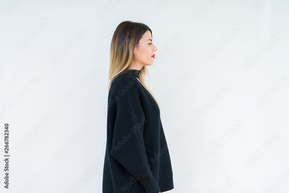 Young woman wearing casual sweater over isolated background looking to side, relax profile pose with natural face with confident smile. Young woman wearing casual sweater over isolated background looking to side, relax profile pose with natural face with confident smile.