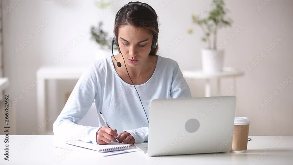 Young woman wearing headset learn foreign language using online course