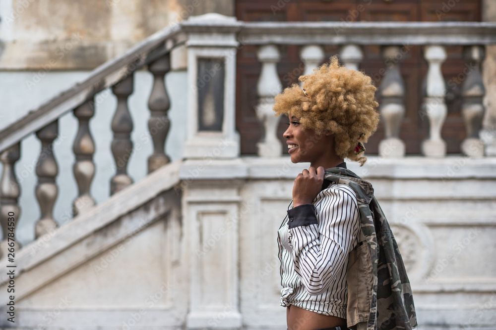 Stylish Black Woman Walking On The Street