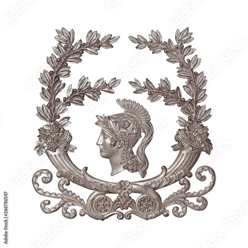 Silver decorative element of the interior with the image of the helmet from the ancient Greek myth. The element is isolated on white background © Elena