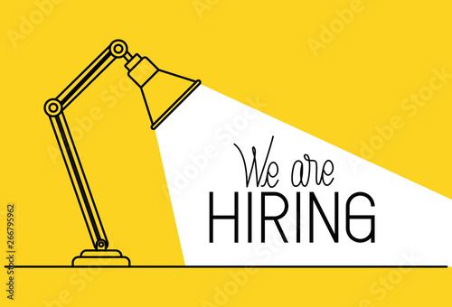lamp desk with we are hiring message