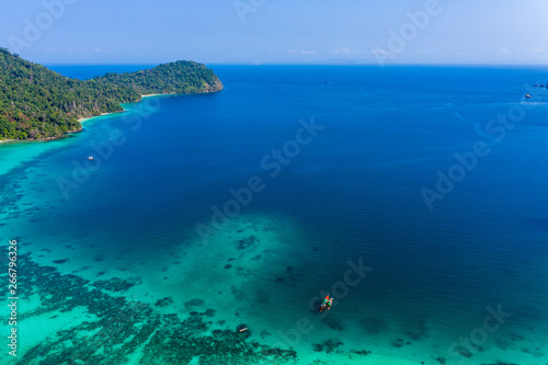 Aerial drone view of a beautiful tropical island surrounded by coral reef (Greater Swinton Island, Myanmar) © whitcomberd