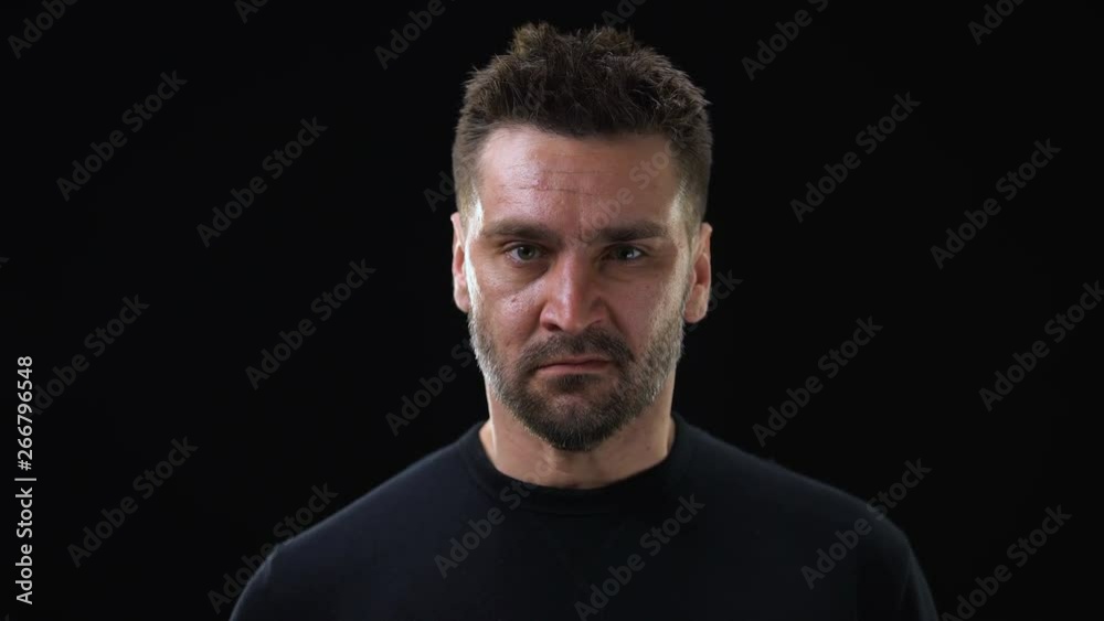 Angry man shouting on dark background, emotional breakdown, outburst neurosis Angry man shouting on dark background, emotional breakdown, outburst neurosis