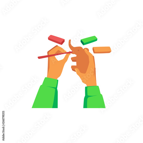 Hands modeling elephant statuette from plasticine cartoon style