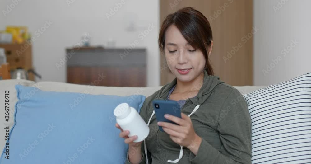 Woman check the ingredients of the medicine at home Woman check the ingredients of the medicine at home