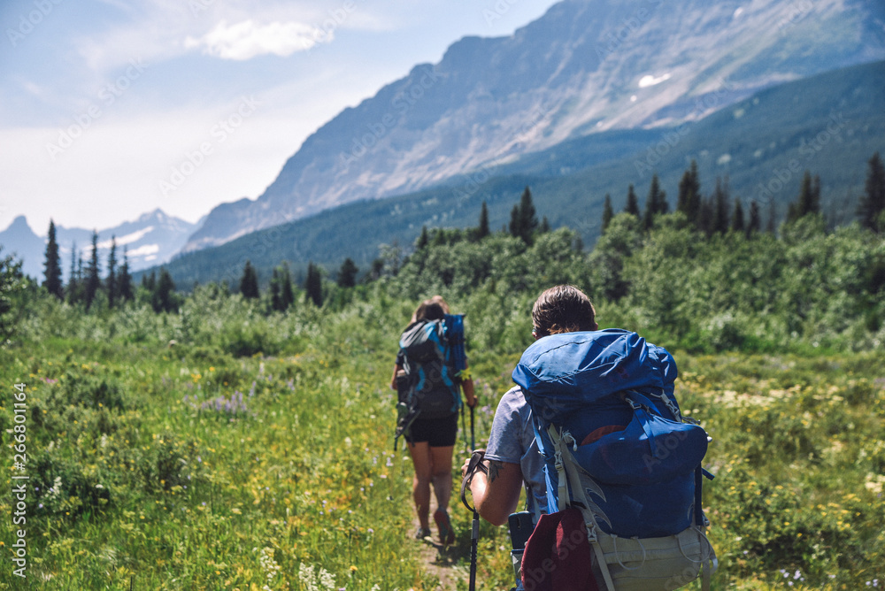 Women Backpacking in Glacier National Park in Montana During Summer