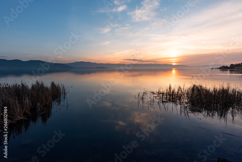 Fototapeta Naklejka Na Ścianę i Meble -  Beautiful sunrise on the lake. Colorful sky.