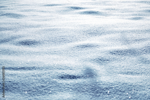 Winter background, natural blue snow texture. Frosty weather with loose snowy surface in wintertime