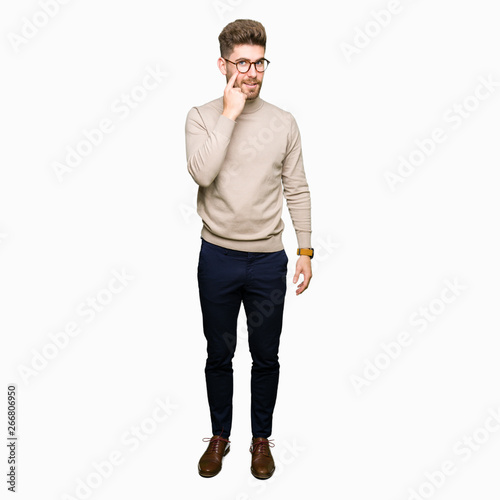 Young handsome business man wearing glasses Pointing to the eye watching you gesture, suspicious expression © Krakenimages.com