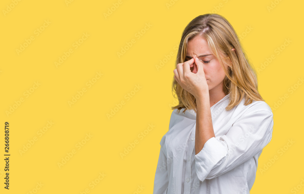 Beautiful young business woman over isolated background tired rubbing nose and eyes feeling fatigue and headache. Stress and frustration concept. Beautiful young business woman over isolated background tired rubbing nose and eyes feeling fatigue and headache. Stress and frustration concept.