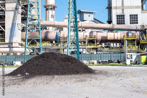 Huge pile of shredded tires used as alternative fuel in rotary kiln in cement plant
