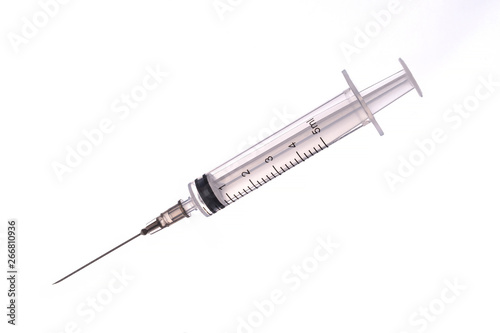 medical syringe with a long needle for the treatment of diseases and beauty shots on a white background photo