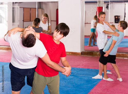 Kids exercising self-defense movements