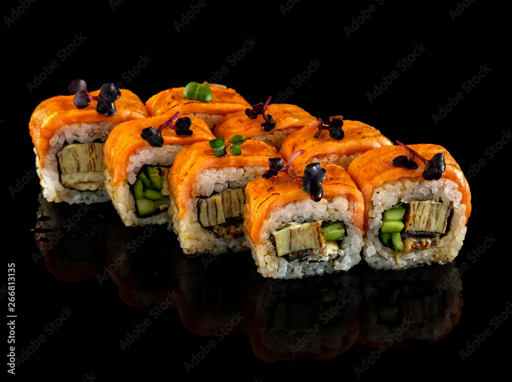 Set sushi roll. Traditional Japanese cuisine. Isolated on black background Set sushi roll. Traditional Japanese cuisine. Isolated on black background