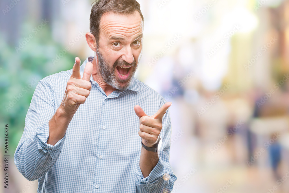 Obraz premium Middle age hoary senior business man over isolated background pointing fingers to camera with happy and funny face. Good energy and vibes.