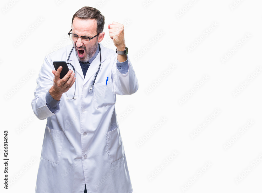 Middle age senior hoary doctor man texting using smartphone over isolated background annoyed and frustrated shouting with anger, crazy and yelling with raised hand, anger concept