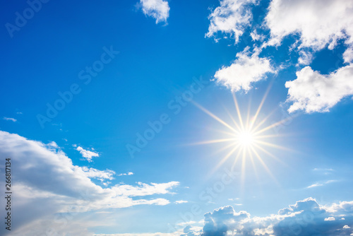 Summer background  wonderful blue sky with bright sun and clouds