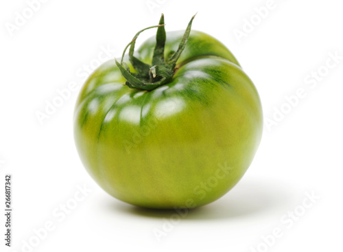 fresh green tomato isolated on white background