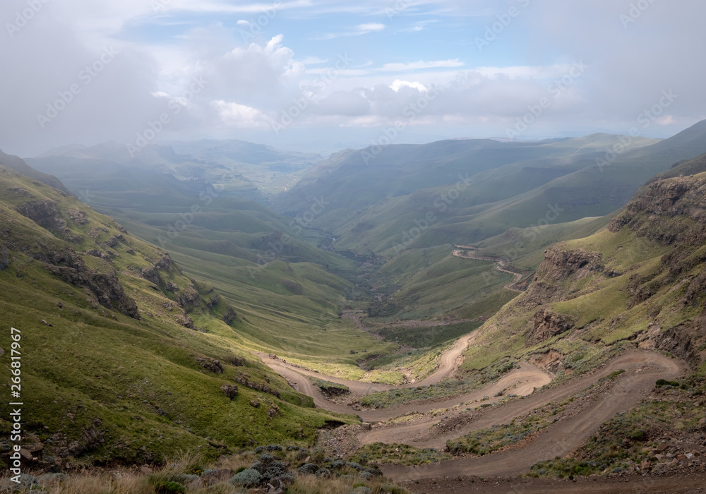 View of the Sani Pass which connects Underberg in South Africa to Mokhotlong in Lesotho. The Sani Pass is the highest mountain pass in the world. View of the Sani Pass which connects Underberg in South Africa to Mokhotlong in Lesotho. The Sani Pass is the highest mountain pass in the world.