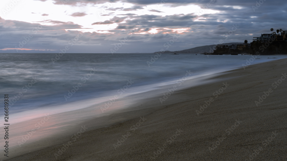 Sunset At The Beach With Silky Smooth Water and Waves Sunset At The Beach With Silky Smooth Water and Waves
