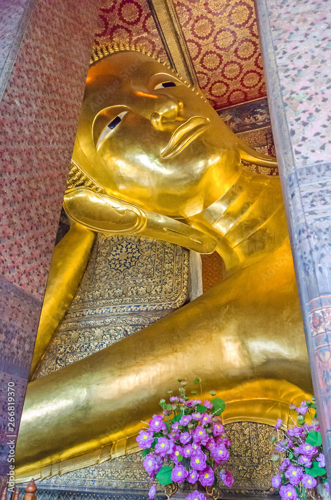 Reclining Buddha  in a Buddhist temple complex Wat Pho in Bangkok
