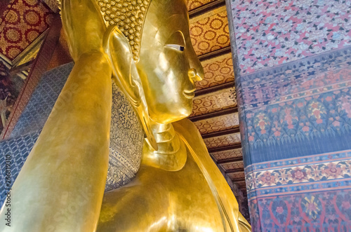 Reclining Buddha  in a Buddhist temple complex Wat Pho in Bangkok photo