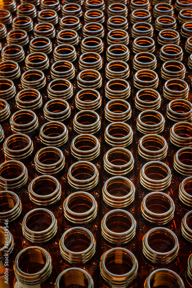Many glass jars for empty medicines assorted in a row, chemical pharmaceutical industry concept. Many glass jars for empty medicines assorted in a row, chemical pharmaceutical industry concept.