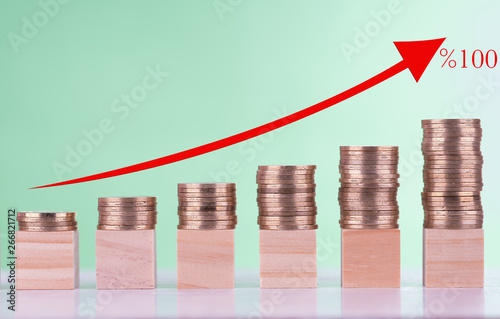 Stack of coins stack up graph with red arrow and one hundred percent symbol, Risk management business financial and investment percentage management interest rates concept