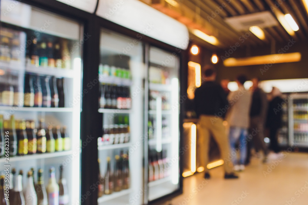 Background Blurred Defocused Beers are cooling in fridge, freezer or