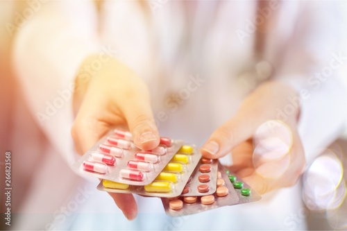 Pills in female hands