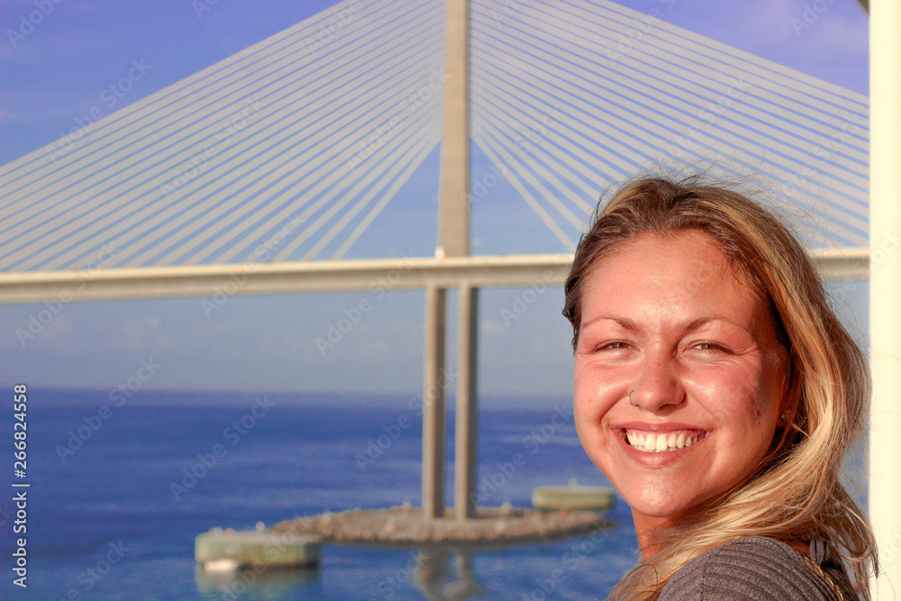 portrait of smiling young girl on deck of cruise ship