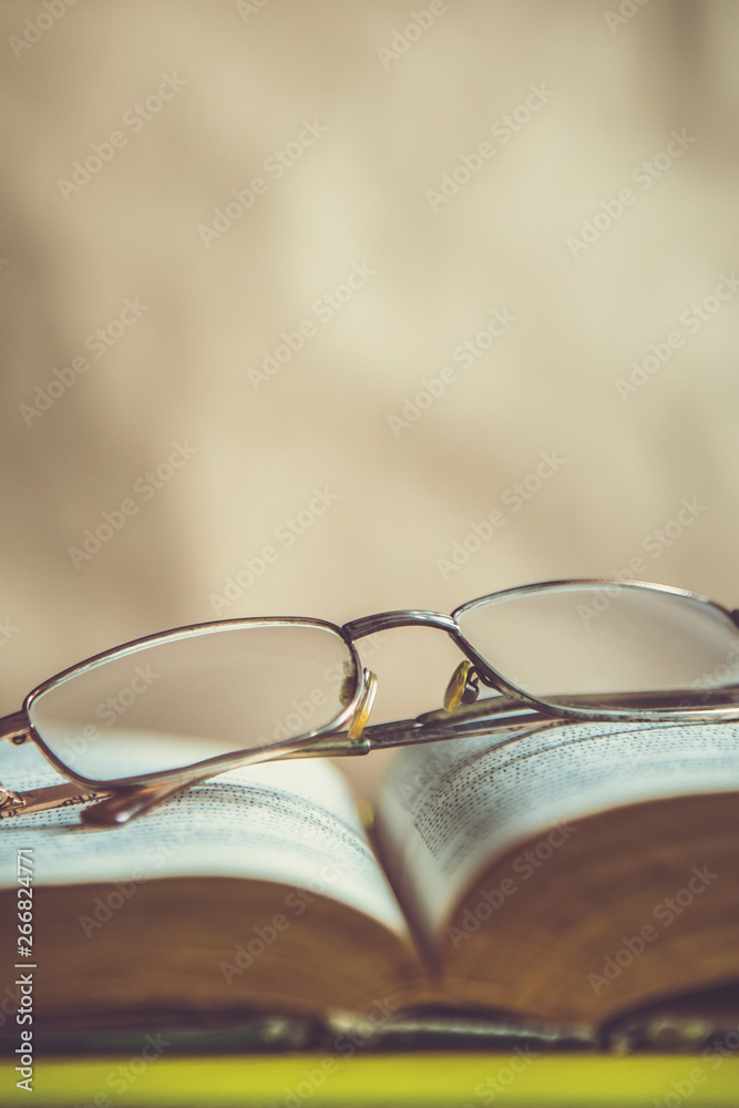 Back to school concept. Glasses on a book. Open book with glasses. Back to school concept. Glasses on a book. Open book with glasses.