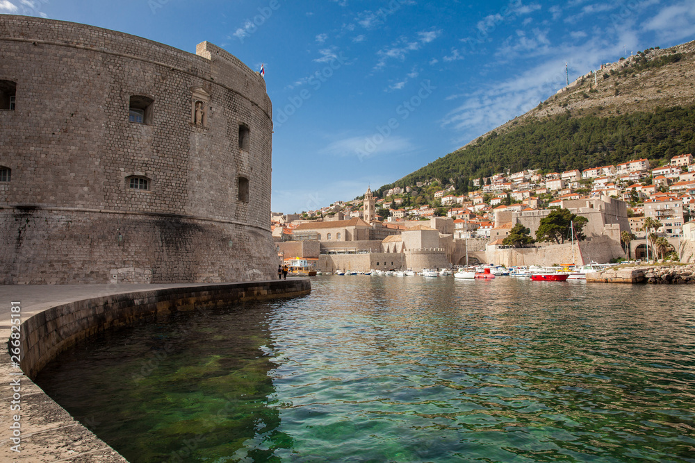Dubrovnik city old port marina and fortifications seen from Porporela