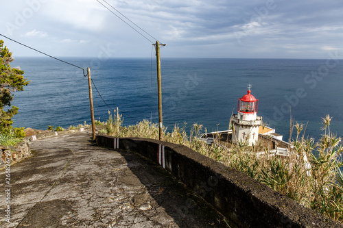 old lighthouse on the shore photo