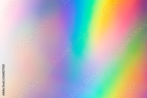 Blurry abstract iridescent holographic foil background. photo