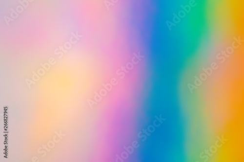 Blurry abstract iridescent holographic foil background.