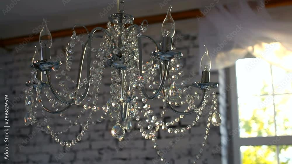 Chandelier in the sunlight. Beautiful background. Chandelier in the sunlight. Beautiful background.