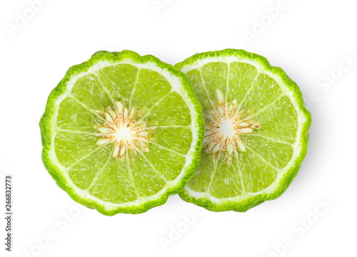 A half of bergamot or kaffir with seeds isolated on white background