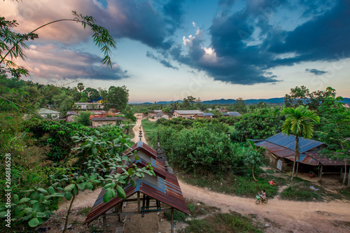 The background of a wooden house in the country (Myanmar village) where tourists can take pictures in public while traveling, surrounded by mountains,mangroves,trees,fresh air.  © bangprik