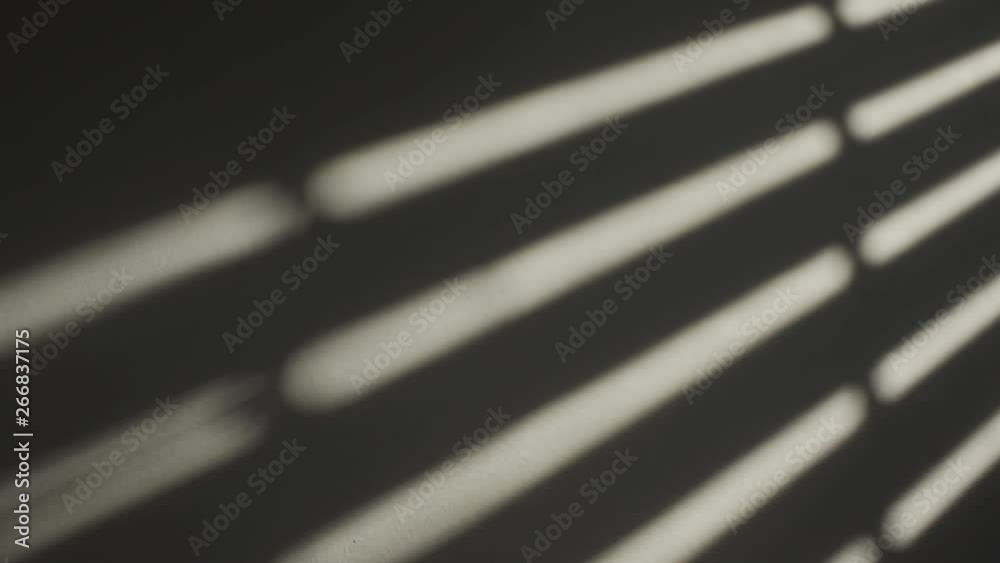 Window shutters closing - making a shadow on the wall - slow motion Window shutters closing - making a shadow on the wall - slow motion