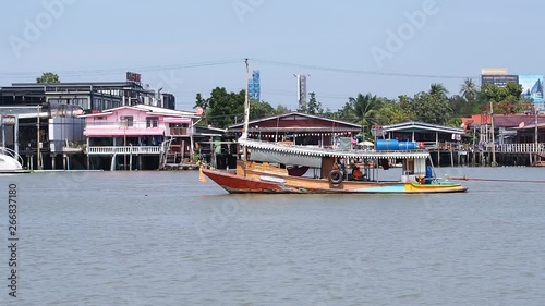 Thai longtail boat at Chaophaya river. Nonthaburi Province, Thailand. photo