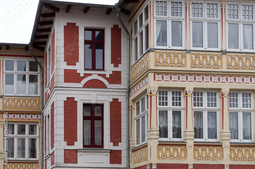 Corner of a historic residential building with many windows