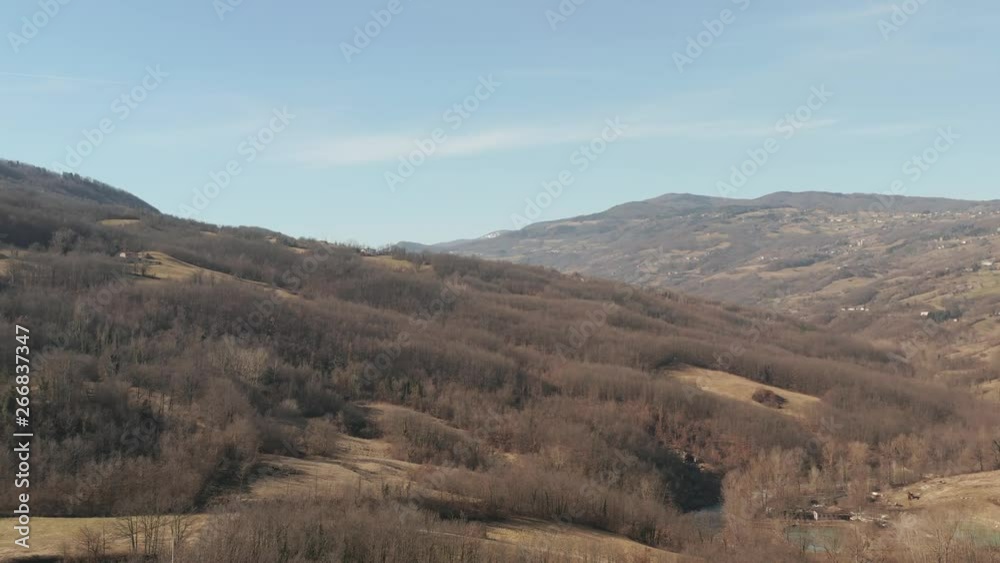 Aerial : cinematic overview over the italian Apennine hills in autumn