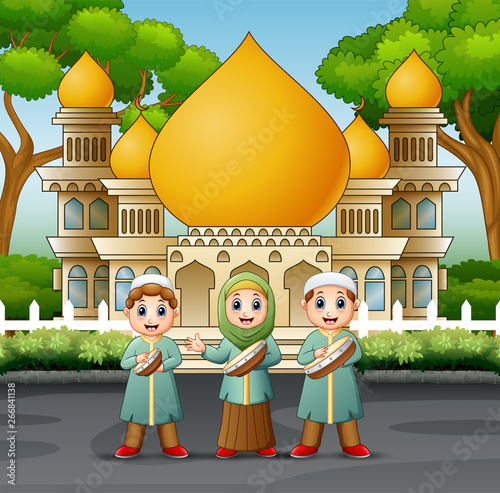 Muslim kids playing tambourine in front the mosque