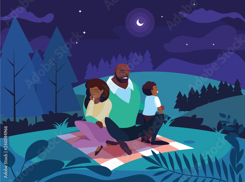 afro parents with son family in night landscape natural