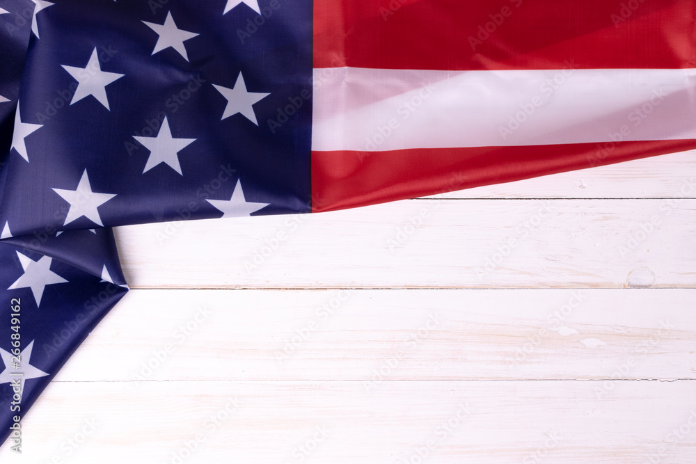 American flag on white wooden background for Memorial Day or 4th of July with copy space.